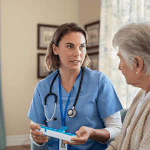 Picture of woman doctor discussing medications with elderly woman patient